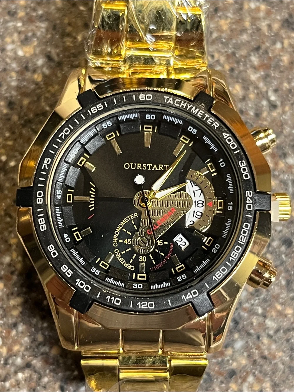 Men’s watch gold tone with black face and date window